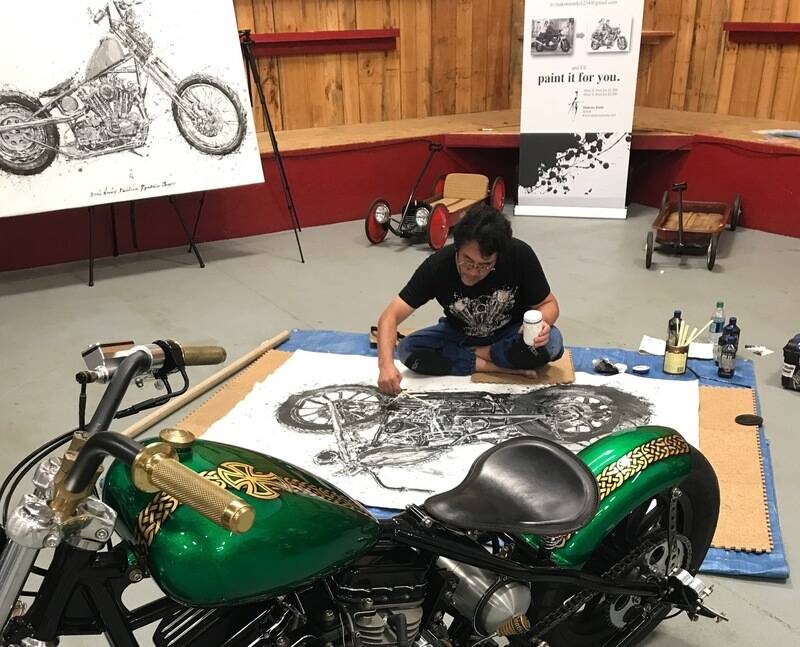 Edge’s bike (painted by Ron Harris) being painted on canvas by Makoto Endo.